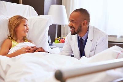 doctor checking young patient